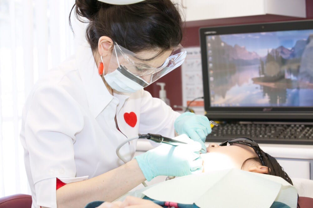 dentist performing on patient