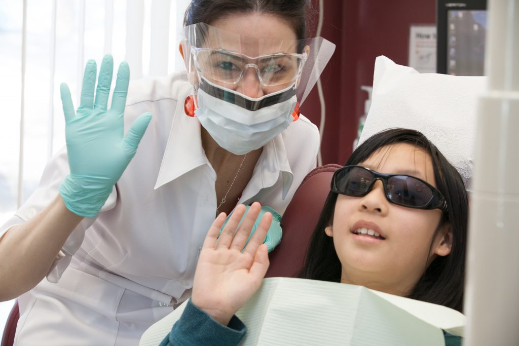 dentist in a clinic with patient